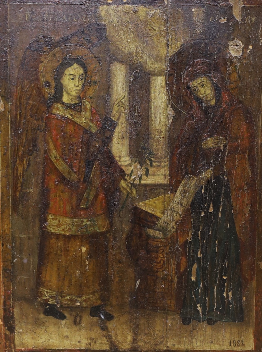 19th century Eastern European School, tempera on wooden panel, Icon depicting The Annunciation, inscribed and dated 1882, 38 x 28cm